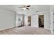 Bright bedroom featuring closet and bathroom barn doors, ceiling fan, and light walls at 2305 Leeward Cv, Kissimmee, FL 34746