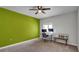 Bedroom with green accent wall and desk at 2305 Leeward Cv, Kissimmee, FL 34746