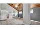Bright bedroom featuring vaulted wood ceilings, large windows and an en-suite bath at 2305 Leeward Cv, Kissimmee, FL 34746