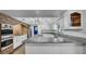 Kitchen featuring white cabinetry, granite countertops, a brick oven feature, and stainless steel appliances at 2305 Leeward Cv, Kissimmee, FL 34746
