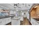 Modern kitchen boasts granite countertops, stainless steel appliances, and a center island at 2305 Leeward Cv, Kissimmee, FL 34746