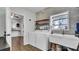 Laundry room features modern appliances, accent wall and adjoins kitchen at 2305 Leeward Cv, Kissimmee, FL 34746