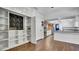 Walk-in pantry with custom shelving and wood-look tile floor at 2305 Leeward Cv, Kissimmee, FL 34746