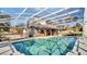 Large, inviting screened pool with surrounding deck and patio at 2305 Leeward Cv, Kissimmee, FL 34746