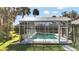 Refreshing screened pool with a spacious deck at 2305 Leeward Cv, Kissimmee, FL 34746