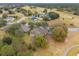 Aerial view of home on golf course community at 24728 Calusa Blvd, Eustis, FL 32736