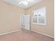 Bright bedroom with neutral walls, carpet, and window shutters at 24728 Calusa Blvd, Eustis, FL 32736