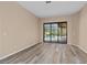 Bright bedroom with sliding glass doors leading to the pool area at 24728 Calusa Blvd, Eustis, FL 32736