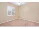 Simple bedroom with window and ceiling fan at 24728 Calusa Blvd, Eustis, FL 32736