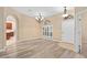 Elegant dining room with hardwood floors and chandelier at 24728 Calusa Blvd, Eustis, FL 32736