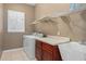 Laundry room with washer, dryer, shelving, and utility sink at 24728 Calusa Blvd, Eustis, FL 32736