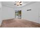 Main bedroom with sliding glass doors leading to the pool and patio area at 24728 Calusa Blvd, Eustis, FL 32736