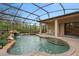 Screened pool and spa with waterfall feature at 24728 Calusa Blvd, Eustis, FL 32736