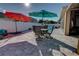 Large backyard with patio furniture and colorful umbrellas at 2518 Hayden Valley St, Apopka, FL 32703