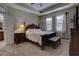 Main bedroom with a king-size bed and ensuite bathroom at 2518 Hayden Valley St, Apopka, FL 32703