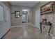 Spacious entryway with tile flooring, a console table, and double doors at 2518 Hayden Valley St, Apopka, FL 32703