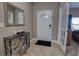 Bright entryway with tile flooring, a decorative console table, and French doors at 2518 Hayden Valley St, Apopka, FL 32703