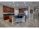 Modern kitchen with dark wood cabinets, granite counters, and a large island at 2518 Hayden Valley St, Apopka, FL 32703