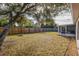 Large backyard with a fire pit and wooden fence at 255 Autumn Ridge Rd, Deltona, FL 32725