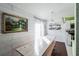 Bright dining area with a long wooden table and white shiplap walls at 255 Autumn Ridge Rd, Deltona, FL 32725