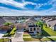 Aerial view of a landscaped home in a residential neighborhood under a blue sky at 2570 Marshfield Preserve Way, Kissimmee, FL 34746