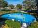 Community splash pad with play features, fencing, landscaping, and neighborhood views at 2570 Marshfield Preserve Way, Kissimmee, FL 34746