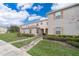 Townhouse exterior with landscaped yard at 2873 Sunstone Dr, Kissimmee, FL 34758