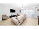 Living room with sectional sofa and flat screen TV at 2873 Sunstone Dr, Kissimmee, FL 34758