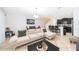 Open living room with beige couch and access to kitchen at 2873 Sunstone Dr, Kissimmee, FL 34758