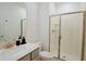 Bathroom with a walk-in shower, toilet, and vanity with a quartz countertop at 2952 Protagonist St, Kissimmee, FL 34746