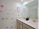 ' bathroom with double vanity and whimsical decor at 2952 Protagonist St, Kissimmee, FL 34746