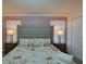 Main bedroom with tall gray headboard and Parisian bedding at 2952 Protagonist St, Kissimmee, FL 34746