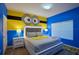 Minion-themed bedroom with a king-size bed and minion wall art at 2952 Protagonist St, Kissimmee, FL 34746