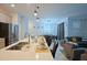 Kitchen island with seating, opens to living area at 2952 Protagonist St, Kissimmee, FL 34746