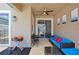 Covered patio with seating, small table, and grill at 2952 Protagonist St, Kissimmee, FL 34746