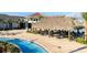 Tropical-themed pool with tiki bar and lounge seating at 2952 Protagonist St, Kissimmee, FL 34746
