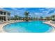Large resort-style pool with plenty of lounge chairs at 2952 Protagonist St, Kissimmee, FL 34746