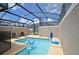 Enclosed pool area with shaded seating and basketball hoop at 2952 Protagonist St, Kissimmee, FL 34746