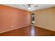 Bedroom with wood floors and large window at 3002 Clubview Dr, Orlando, FL 32822