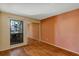 Bedroom with wood flooring, mirrored closet doors and a window at 3002 Clubview Dr, Orlando, FL 32822