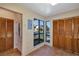 Spacious entryway with wooden closets and a view into the living area at 3002 Clubview Dr, Orlando, FL 32822