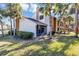 Exterior view of a two story condo unit with a screened in patio at 3002 Clubview Dr, Orlando, FL 32822