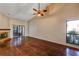 Bright living room with hardwood floors, a fireplace, and a ceiling fan at 3002 Clubview Dr, Orlando, FL 32822