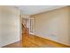Bedroom with hardwood floors, neutral walls, and white french doors that open to stairway at 3002 Clubview Dr, Orlando, FL 32822