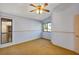 Bedroom with plush carpet, a large window, and a ceiling fan at 3002 Clubview Dr, Orlando, FL 32822