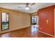 This bedroom features hardwood floors, a ceiling fan, and access to an outdoor patio area at 3002 Clubview Dr, Orlando, FL 32822