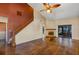 Bright living room features vaulted ceilings, fireplace, hardwood floors, and sliding glass doors to outdoor space at 3002 Clubview Dr, Orlando, FL 32822