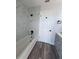 Bathroom with soaking tub and flooring at 3027 Eagle Lake Dr, Orlando, FL 32837