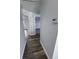 Bright hallway with wood-look flooring at 3027 Eagle Lake Dr, Orlando, FL 32837