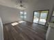 Living area with pool access and vinyl flooring at 3027 Eagle Lake Dr, Orlando, FL 32837